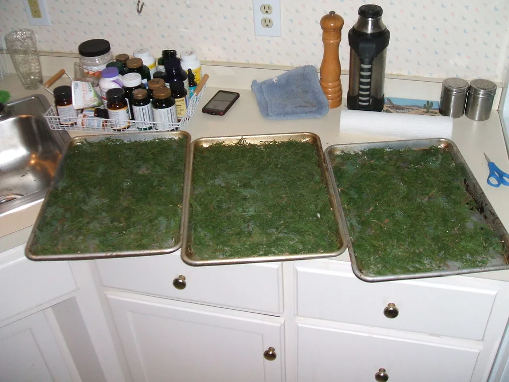 Close-up of a heavy-duty baking sheet corner with thick rim and parchment crumbs