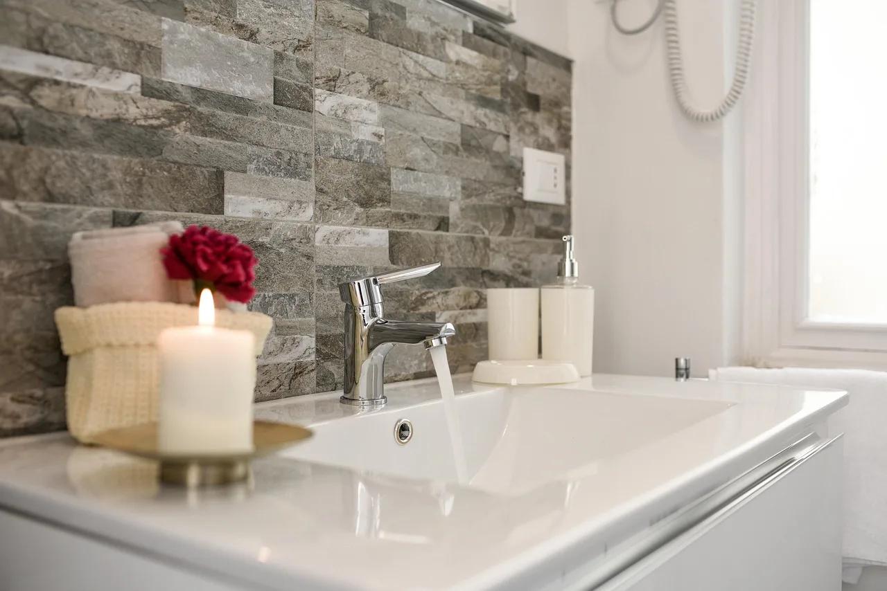 How often should a home bathroom be cleaned?