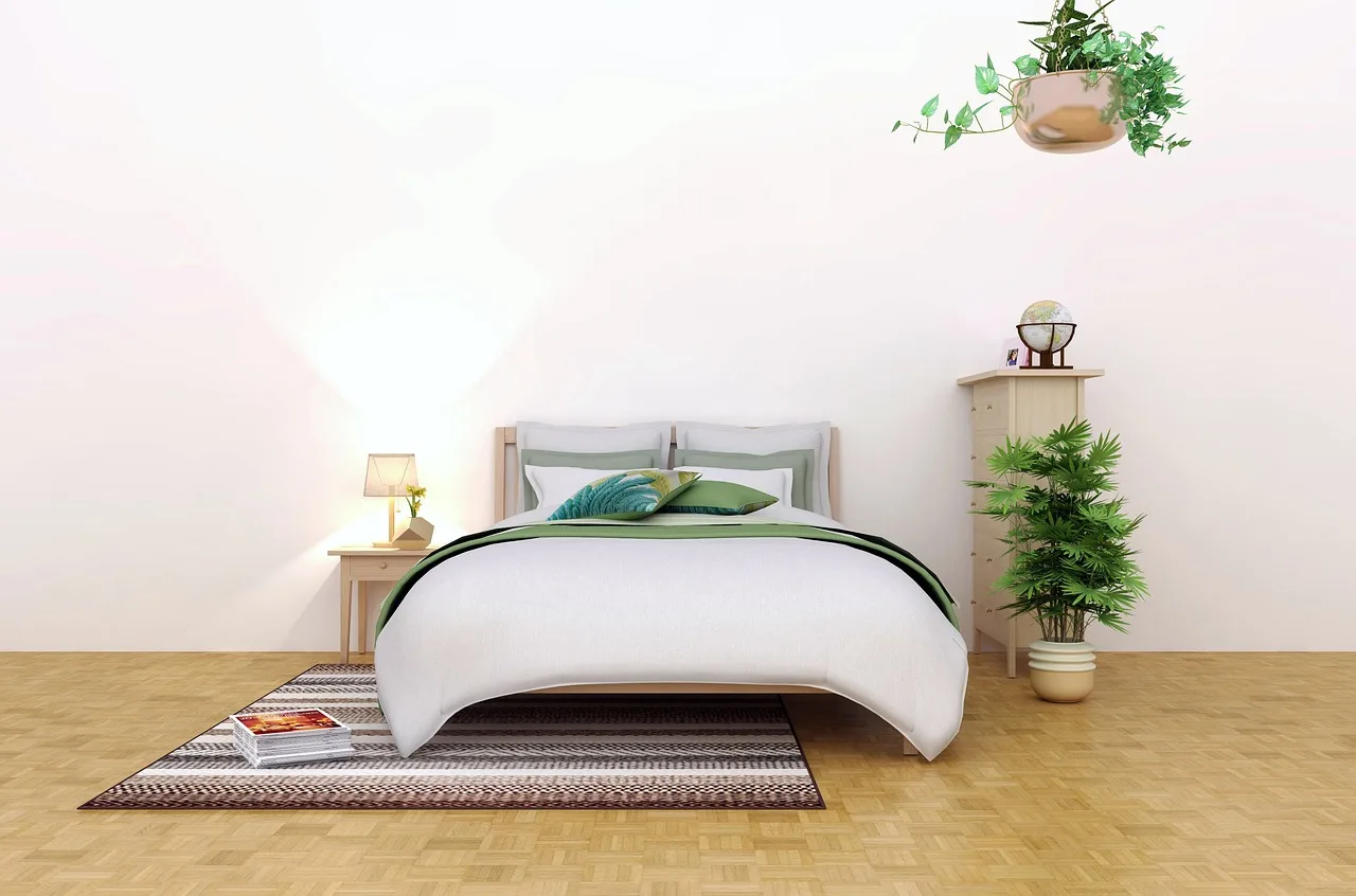 A cozy bedroom with a plush bedroom rug under the bed on a hardwood floor in natural light