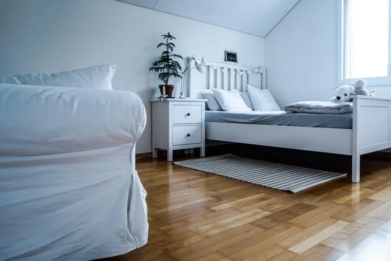 Modern bedroom dresser with a heat-resistant top protector under decor in natural light