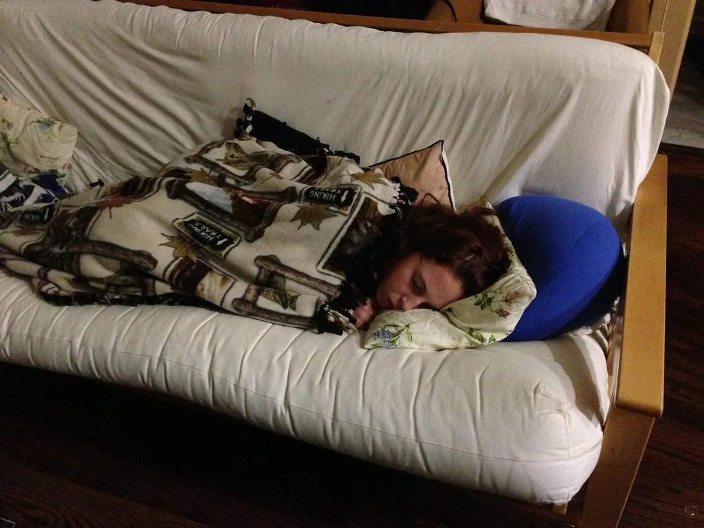 Compact recliner in a small living room with clear walkways and a measuring tape on the floor