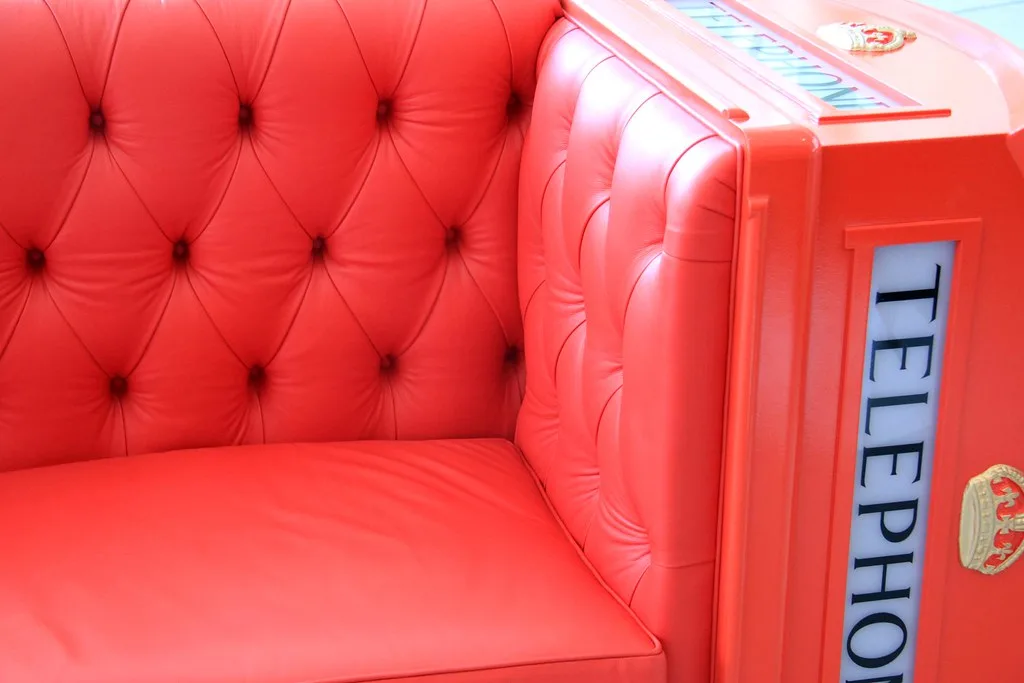 Close-up of corner guards and moving blankets protecting a sofa arm for shipping