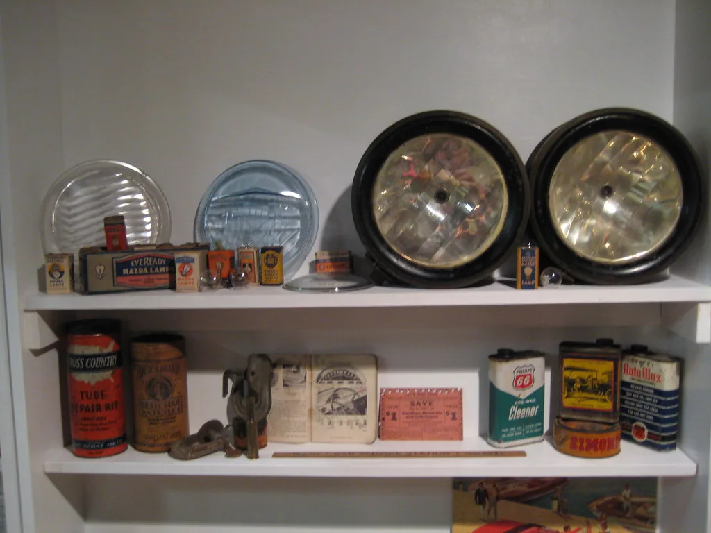 Cookware maintenance kit beside stainless steel, cast iron, and nonstick pans on a kitchen counter.
