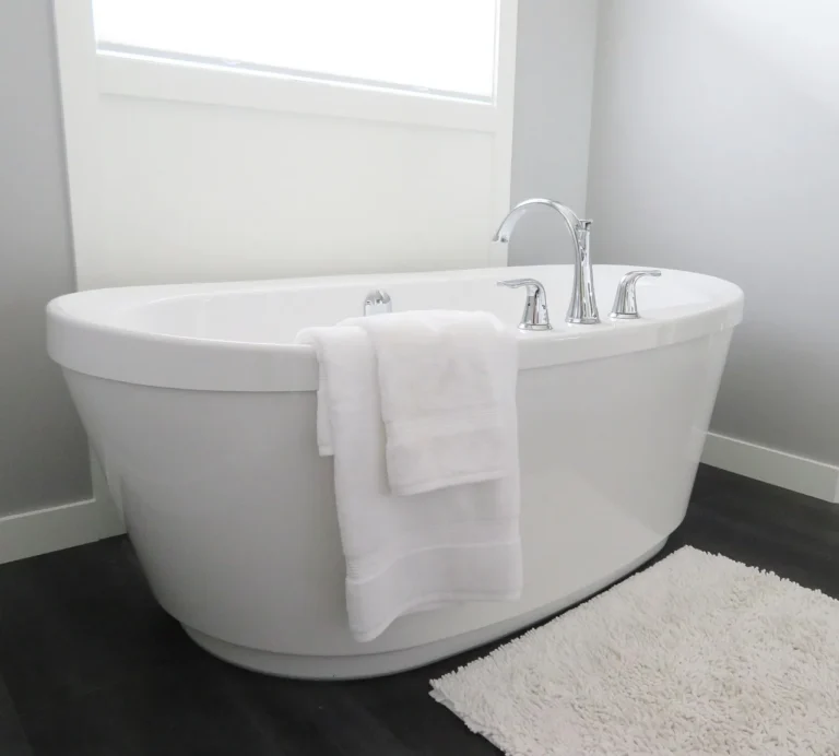 Moen Adler bathroom faucet on a white sink in a bright lived-in bathroom