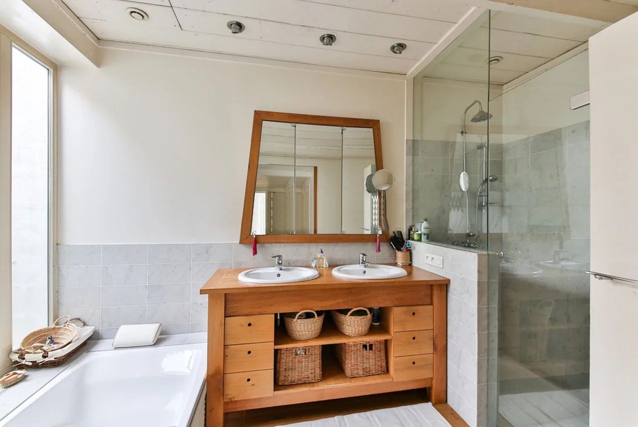 How do bathroom layout and ventilation change the choice?