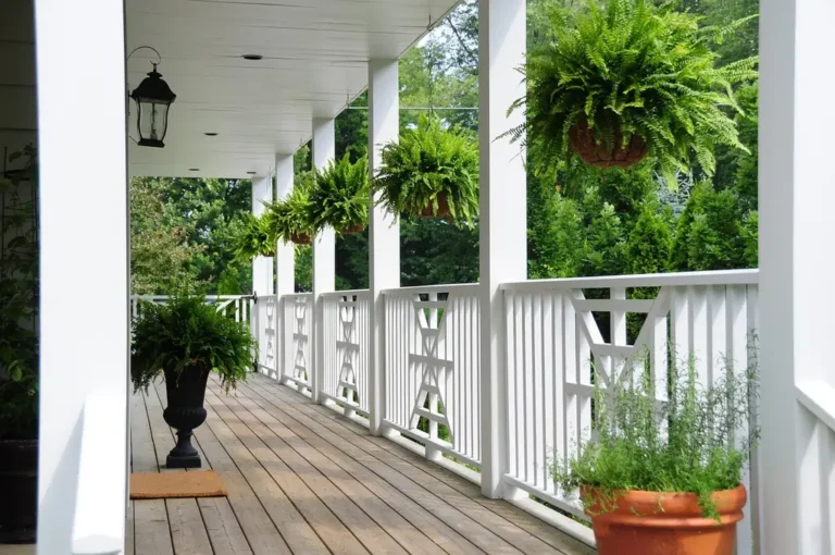 House exterior with a front porch at ground level and an upper balcony above it
