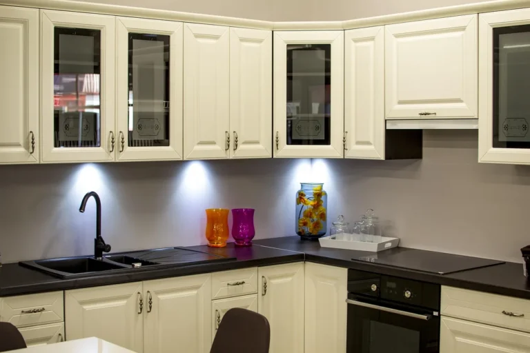 Kitchen renovation with base cabinets below and wall cabinets above on an unfinished wall