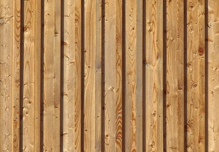 Futon frame with wooden bed slats being measured in natural light