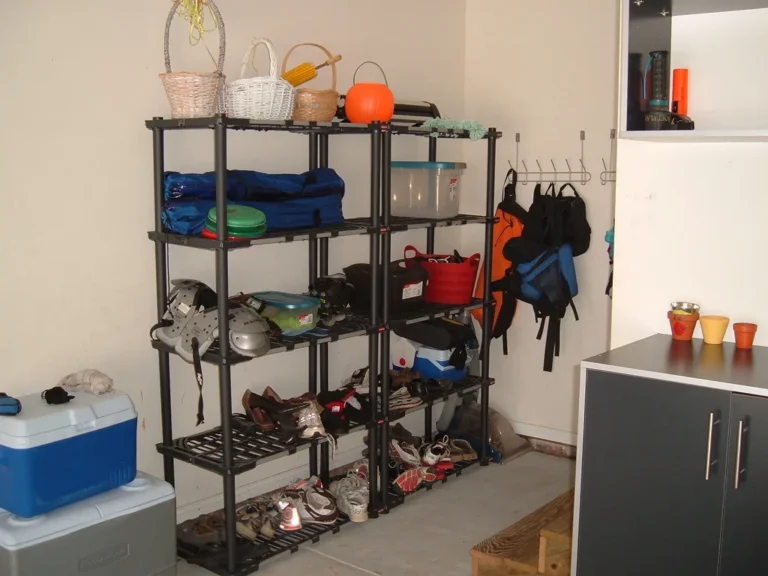 Small kitchen corner cabinet with a blind-corner organizer and tape measure