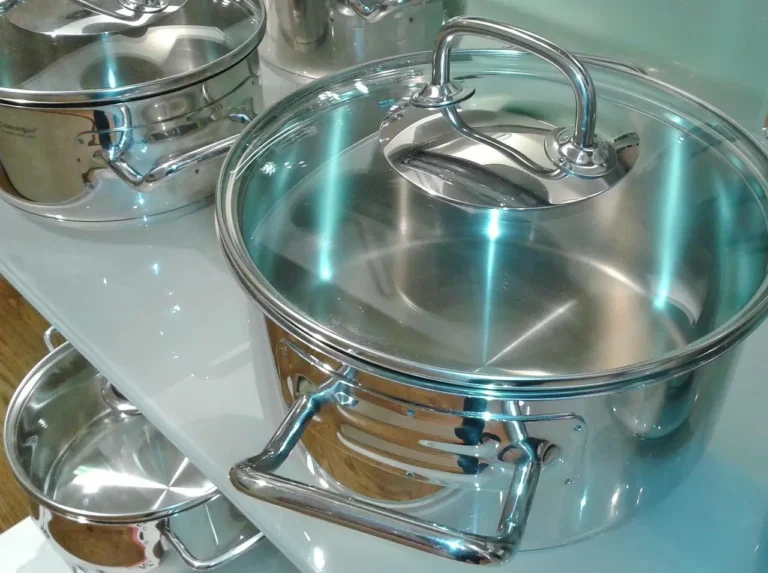 Stainless steel cookware set in a busy family kitchen during dinner prep