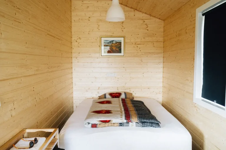 Boho bedroom and farmhouse bedroom split in one room with layered textiles, shiplap, and neutral decor