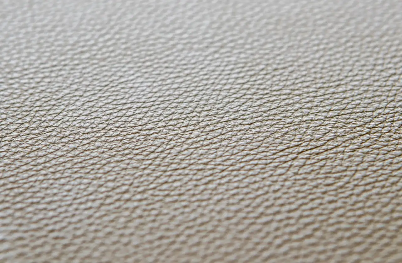 How do you clean and condition a leather sofa?