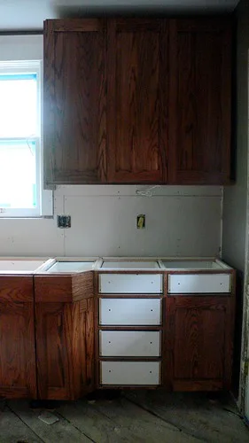 Close-up of cabinet joinery and hinge placement in face frame cabinets vs frameless cabinets