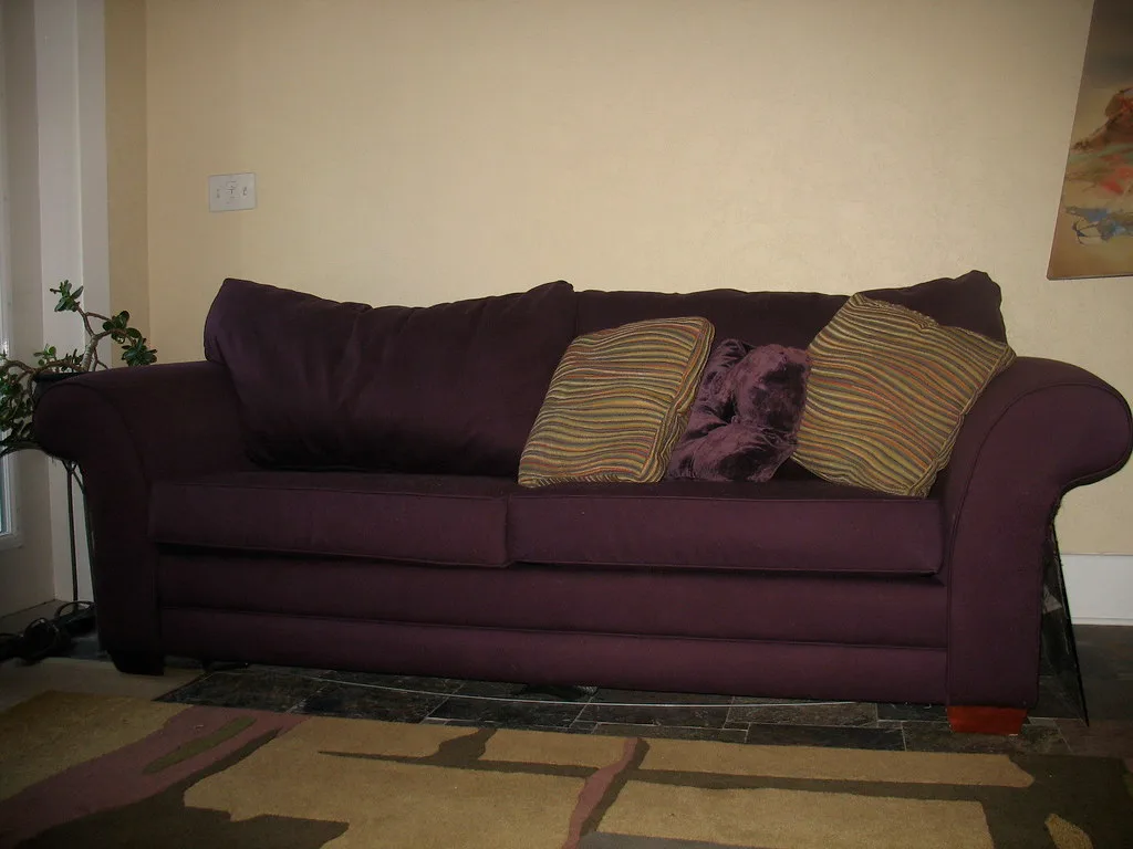 Close-up of a sleeper sofa mechanism and support frame being unfolded