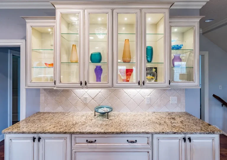 Home Depot kitchen cabinets on showroom displays with a homeowner and contractor comparing finishes