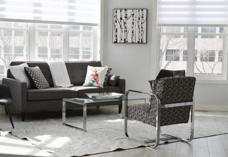 A sinking sofa cushion being pressed by a homeowner in a sunlit living room