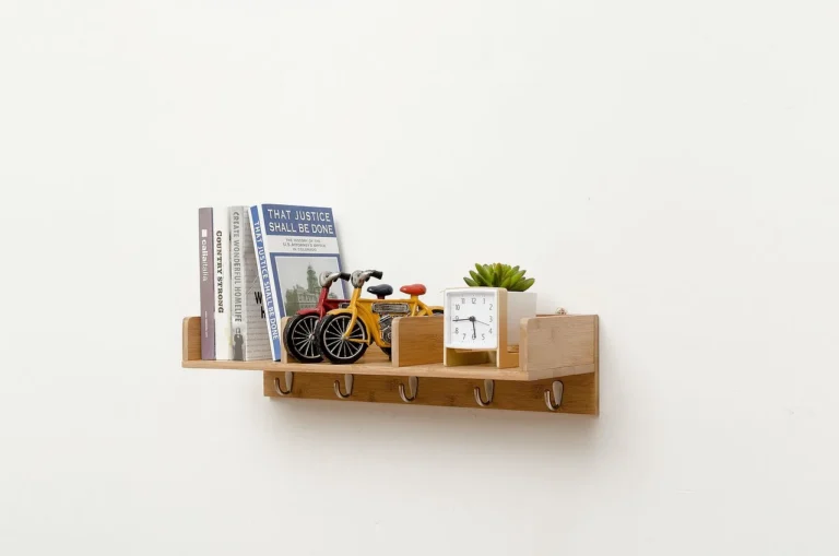 Wall bookshelf system in a bright living room, with floating shelves and a built-in unit being installed.