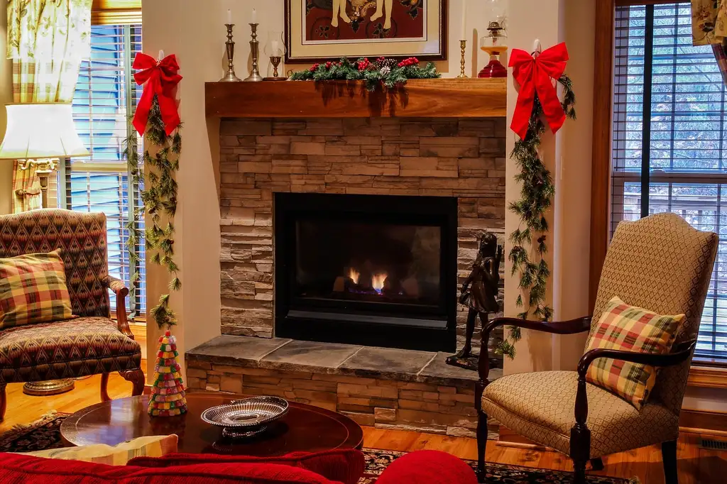 How do you decorate a fireplace mantel with a TV above it for Christmas?