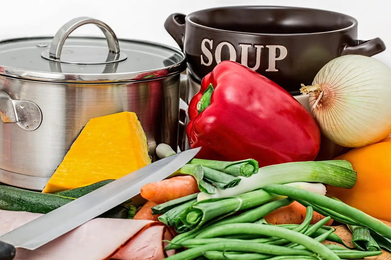 Instant Pot on a kitchen counter with a Ramadan meal prep spread of chicken, rice, dates, and vegetables