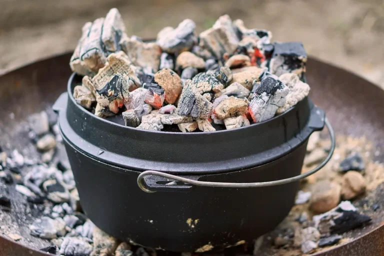 Le Creuset Dutch oven on a Ramadan table with lamb stew, dates, flatbread, and herbs