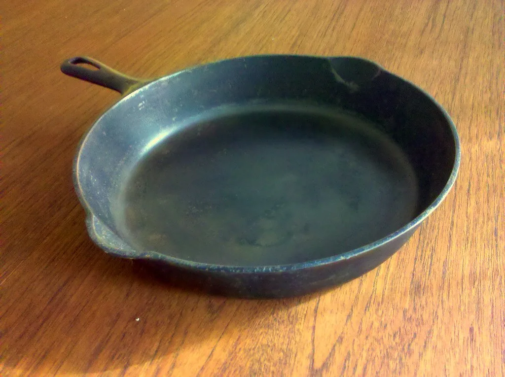 Le Creuset Signature Skillet close-up with browned fond and pan drippings