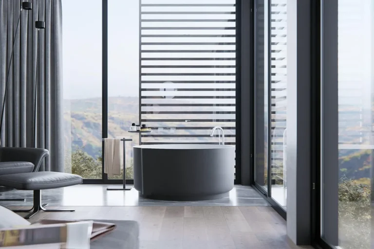Moen bathroom faucet on a white sink with hands testing the handle in natural light