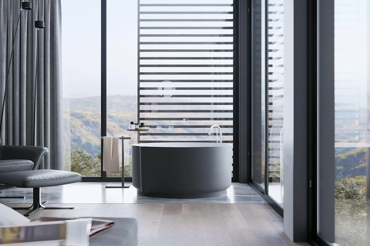 Moen bathroom faucet on a white sink with hands testing the handle in natural light