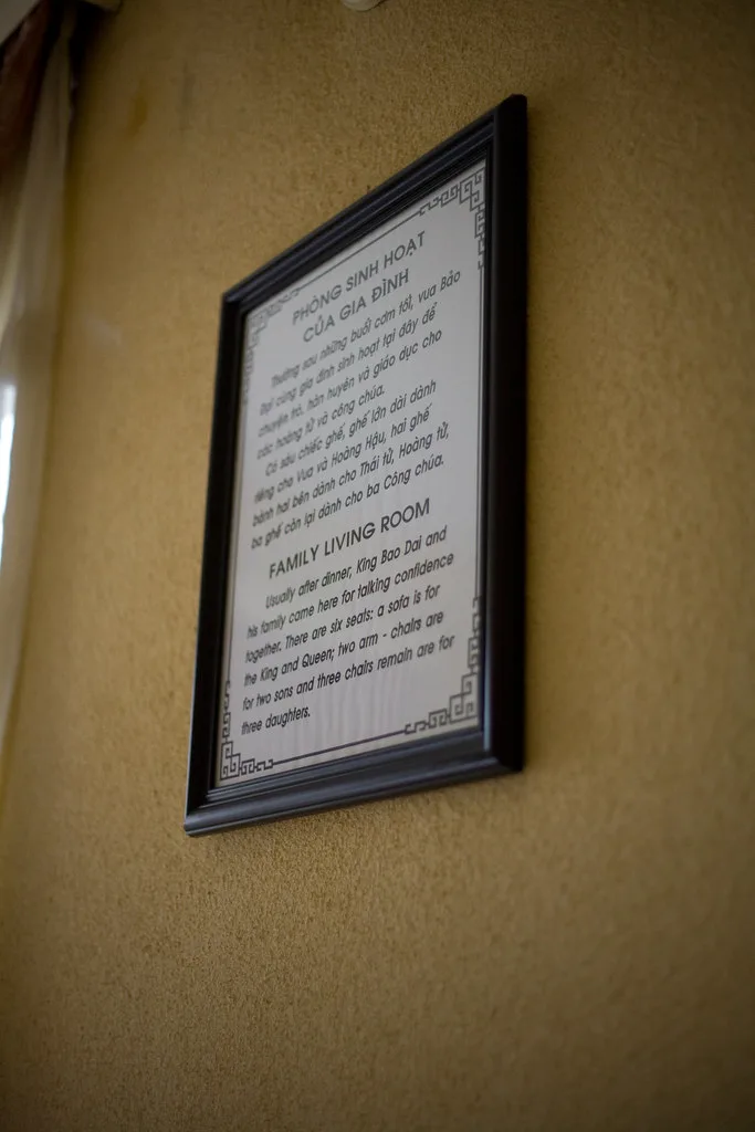 Close-up of a pouf and a floor cushion on a woven rug being compared for height and firmness.