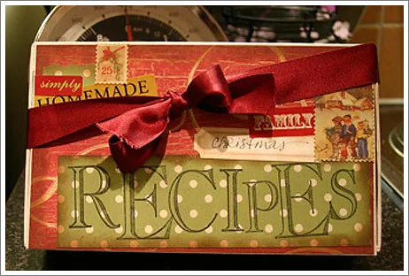 Hand sorting recipe cards inside a Ramadan Recipe Box with sturdy dividers