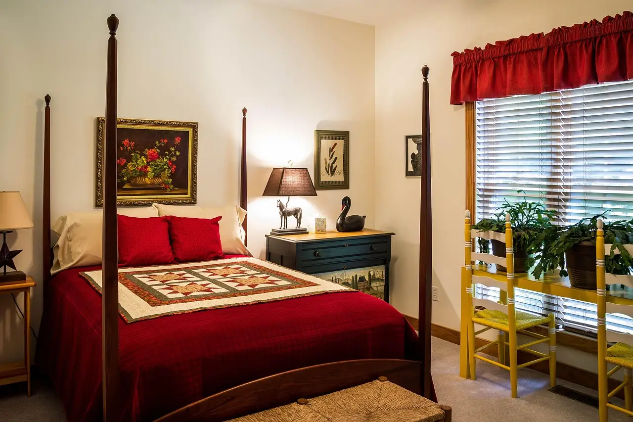 Sauder dresser in a modest bedroom with natural light and visible everyday wear