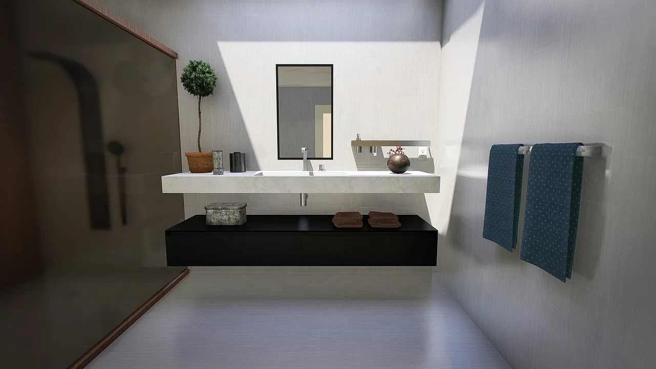 Modern bathroom with a shower curtain beside a frameless glass shower door in natural light